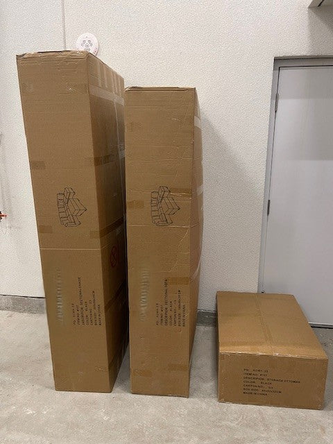 Close-up detail of the Roma Black Faux Leather storage ottoman lid lifted, clearly revealing the internal storage capacity for blankets or accessories.