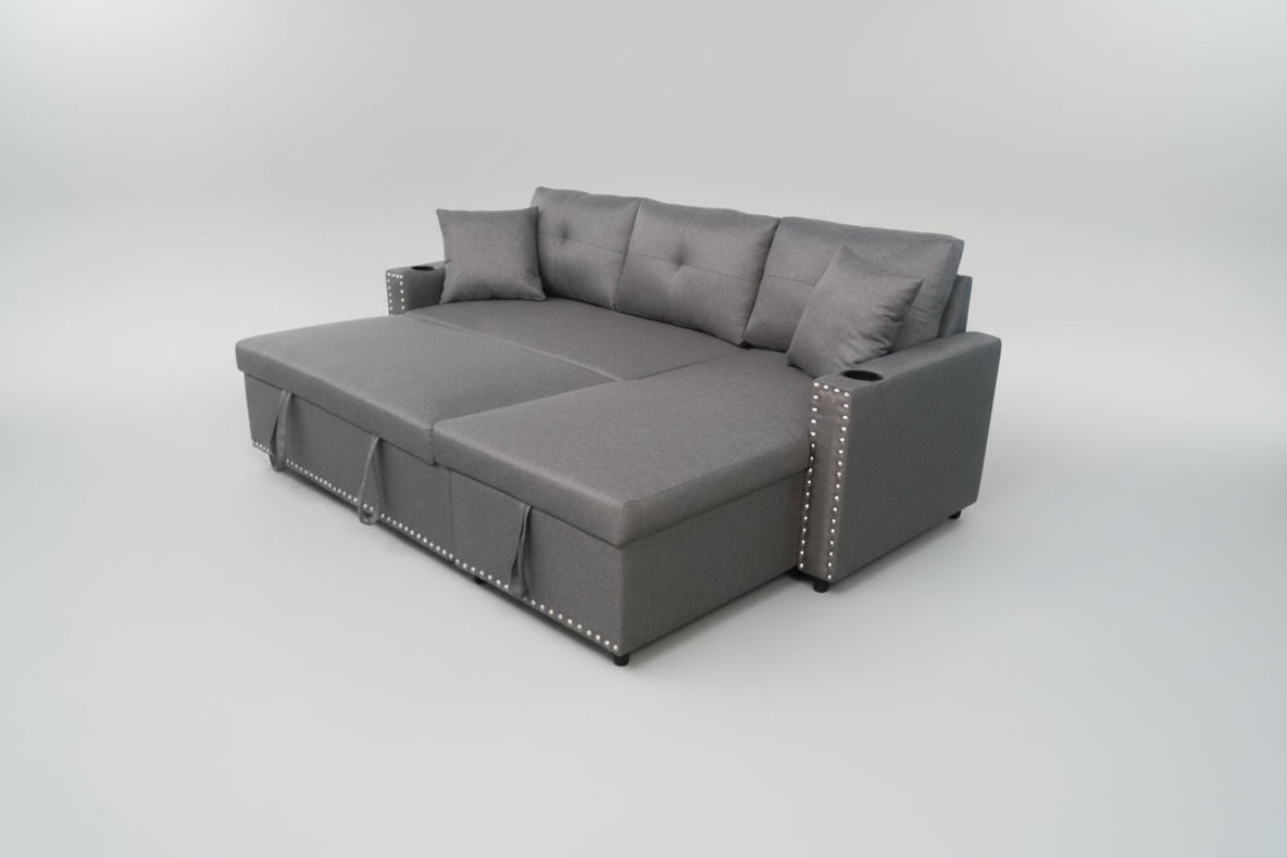 Full view of the Santos Light Grey Fabric Reversible Sectional Sofa, showcasing the neutral color and the pull-out sleeper function extended.