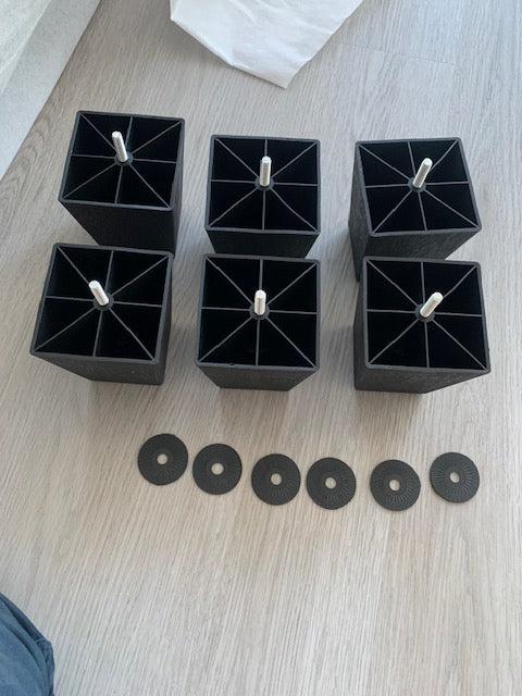 View of the sectional with the center backrest fully folded down to reveal the integrated cupholders, showcasing the convenient beverage storage feature.