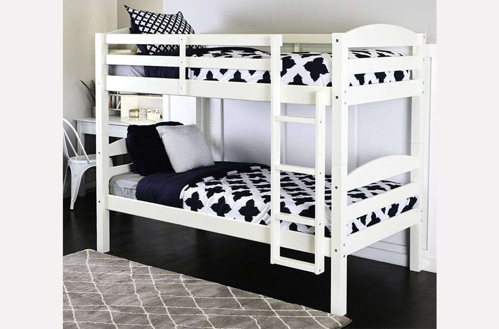 Close-up of the solid pine bunk bed, highlighting the safe, sturdy integrated ladder and the secure top bunk guardrails.