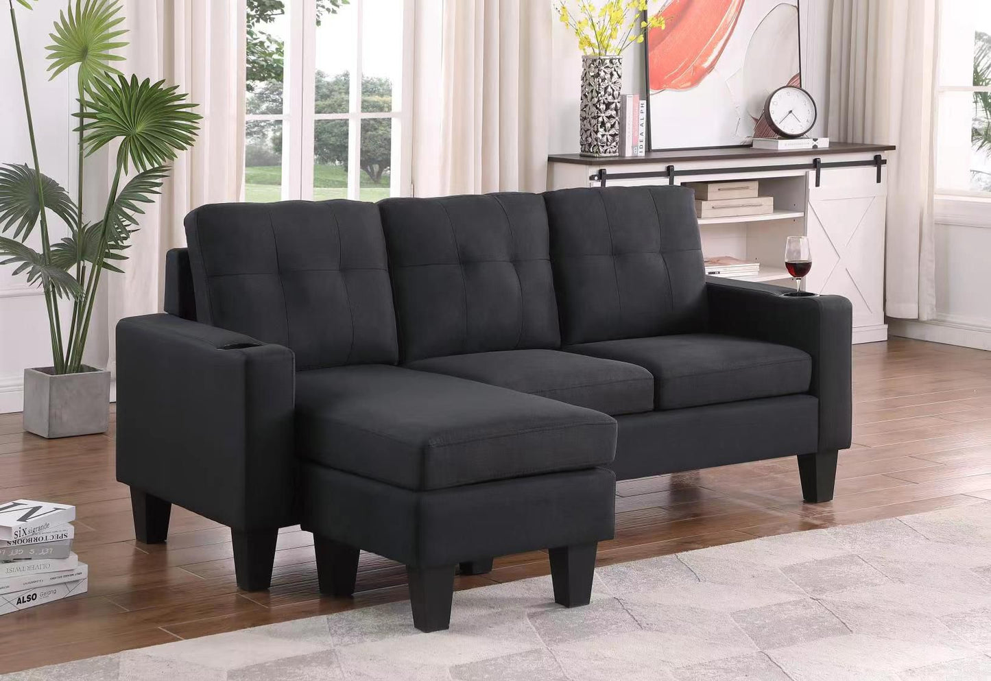 Close-up view of the sectional's back cushions, emphasizing the plush softness and textured weave of the Black Linen fabric for enhanced comfort.