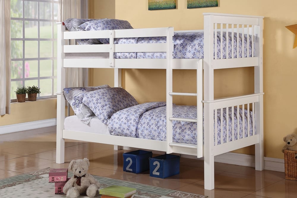 Solid pine wood twin over twin bunk bed in white finish, featuring guardrails and an integrated ladder in a brightly lit children's room.