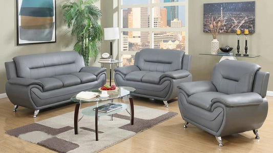 Full view of the Speedy Grey Faux Leather Tufted 3-Piece Set, showcasing the matching sofa, loveseat, and chair with tufting visible on the backrests.