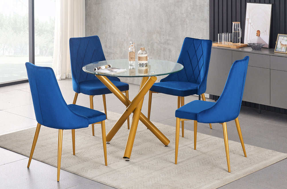Detailed shot of a single velvet upholstered dining chair, emphasizing the fabric texture and the sleek coordinating brushed gold legs of the chair.