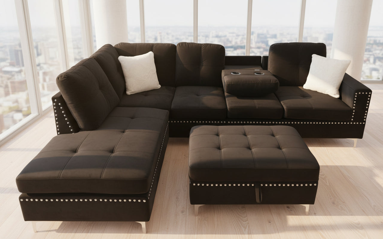 Full view of the Velvet Reversible Sectional Sofa, showcasing the plush fabric, the decorative nailhead stud trim, and the matching storage ottoman.