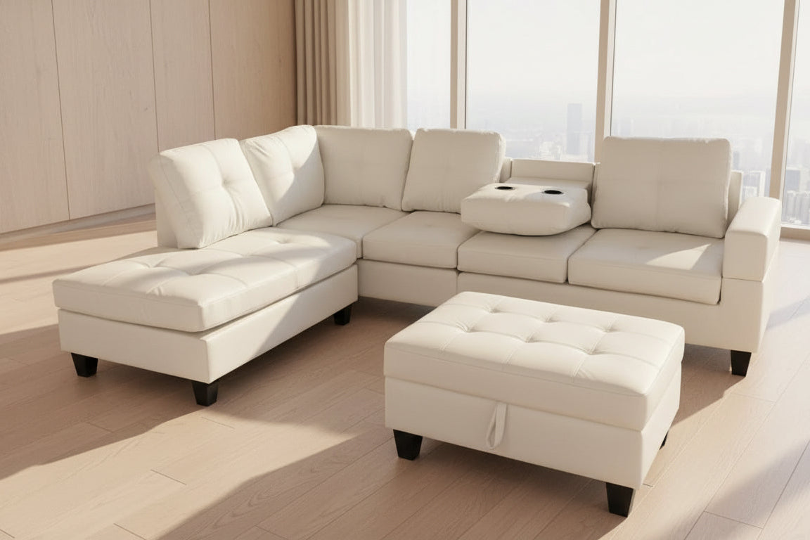 Full view of the White Leather Reversible Sectional Sofa, showcasing the bright upholstery, storage ottoman, and the center console with cup holders.