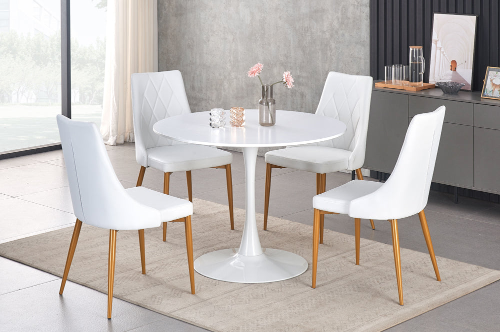 Full view of the White Round Dining Table and four matching chairs upholstered in crisp White Leatherette for a clean, modern look.