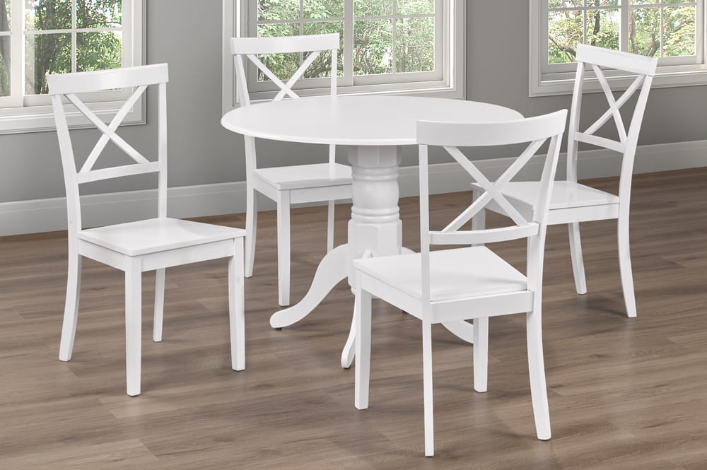 Full view of the White Solid Wood Round Pedestal Dining Set, showcasing the classic pedestal base and the four chairs with a decorative cross-hatch back design.